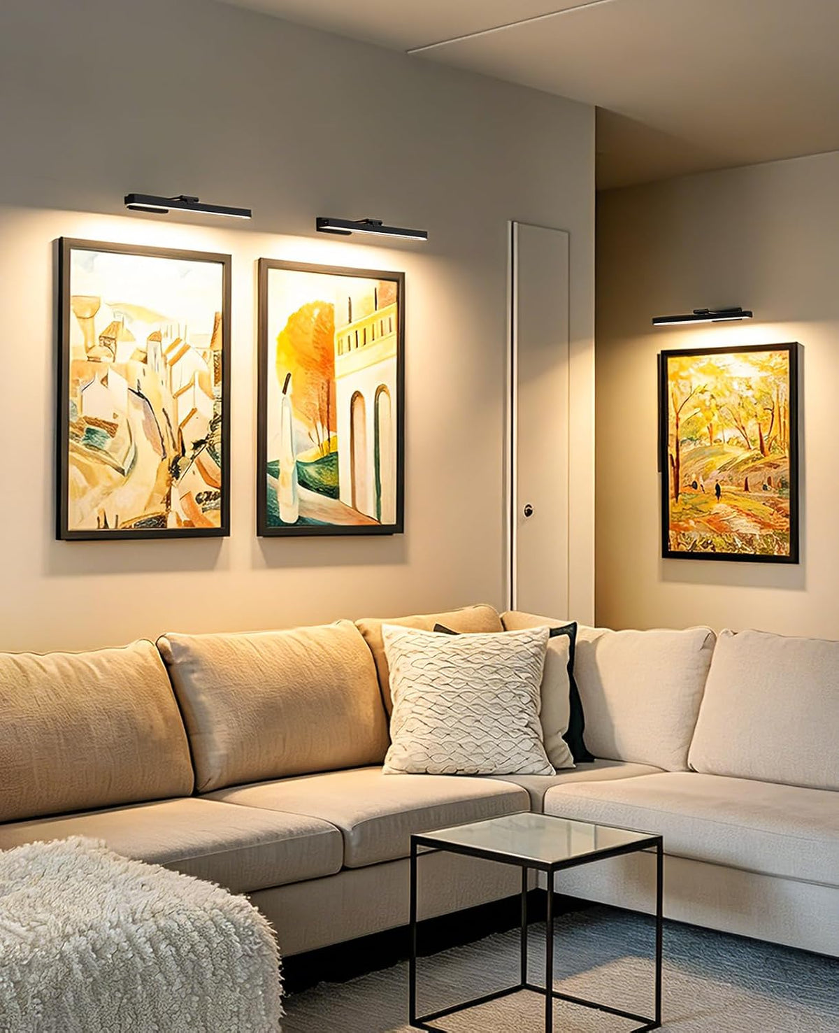 16in Rechargeable Picture Light in Black, above a sofa with framed art – HUDYOGY